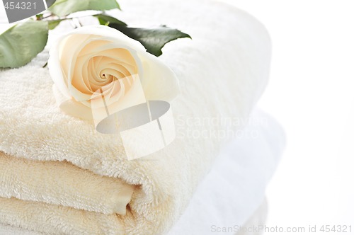 Image of Stack of towels and rose