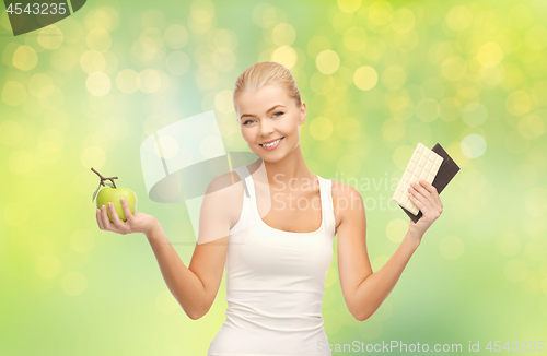 Image of woman choosing between green apple chocolate