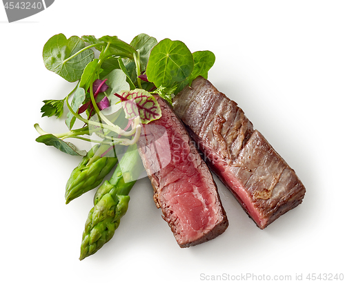 Image of beef wagyu steak meat with herbs and asparagus isolated on wight