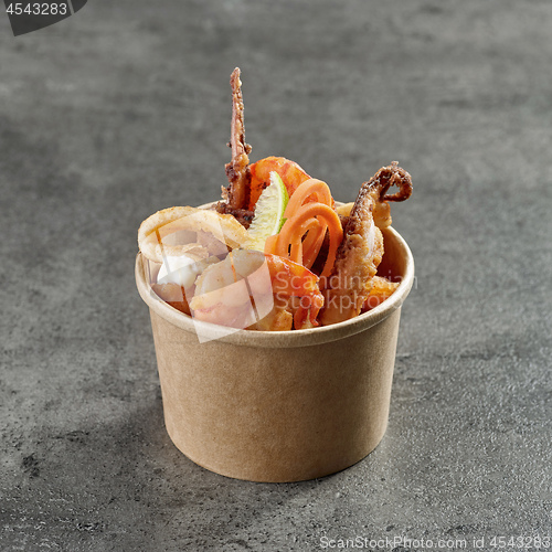 Image of fried sea food snacks in paper box