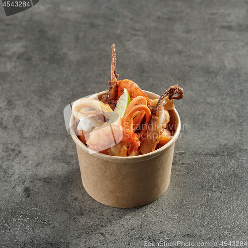 Image of fried sea food snacks in paper box