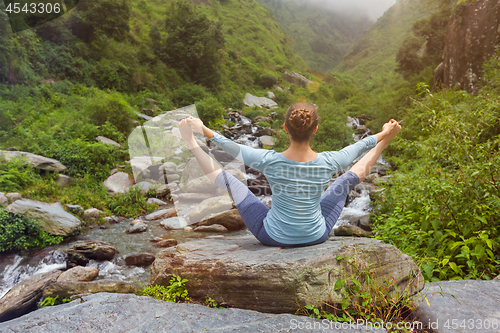 Image of Woman doing yoga outdoors