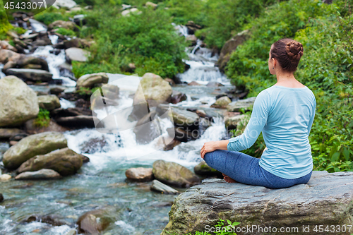 Image of Woman in Padmasana outdoors