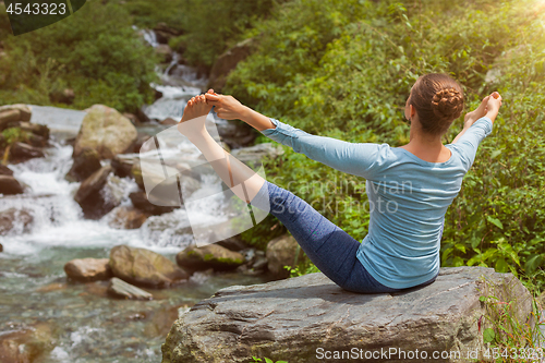 Image of Woman doing yoga outdoors