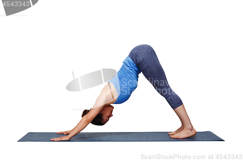 Image of Woman doing Ashtanga Vinyasa yoga asana Adhomukha svanasana 