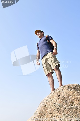 Image of Hiker standing on a rock