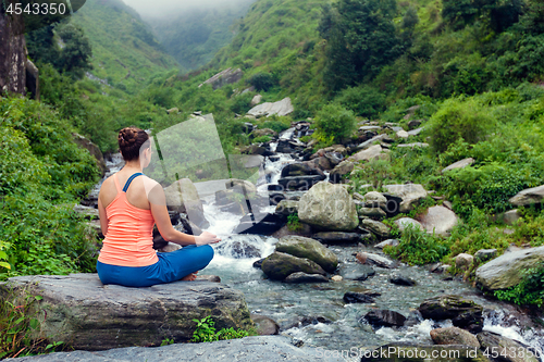 Image of Woman doing yoga outdoors