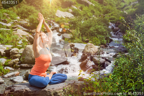 Image of Woman in Padmasana outdoors