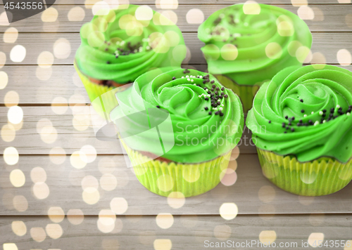 Image of close up of cupcakes with green buttercream