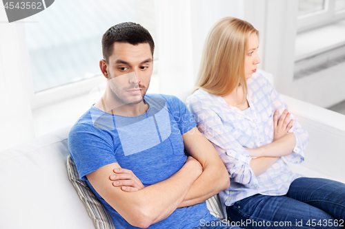 Image of unhappy couple having argument at home