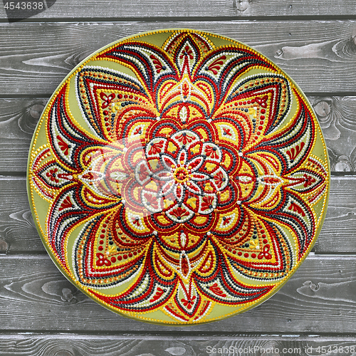 Image of Decorative ceramic plate, hand painted dot pattern with acrylic 