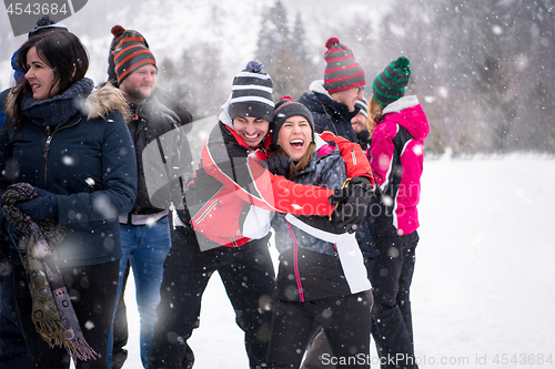 Image of portrait of group young people in beautiful winter landscape