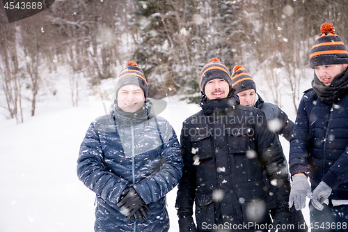 Image of portrait of group young people in beautiful winter landscape