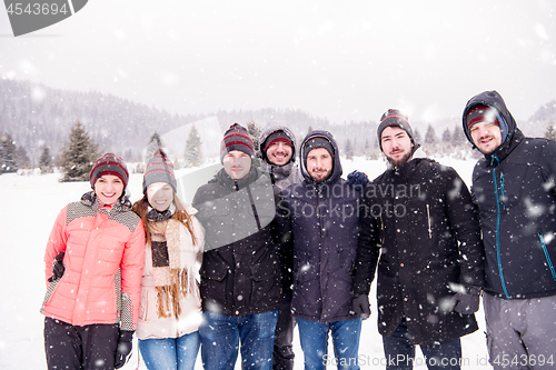 Image of portrait of group young people in beautiful winter landscape