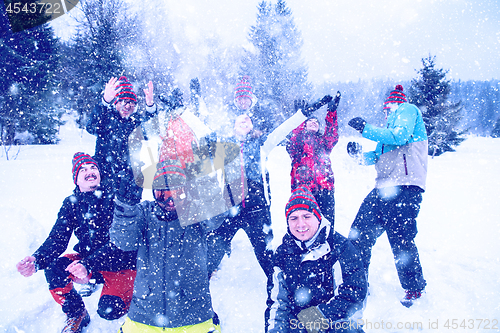 Image of group of young people throwing snow in the air