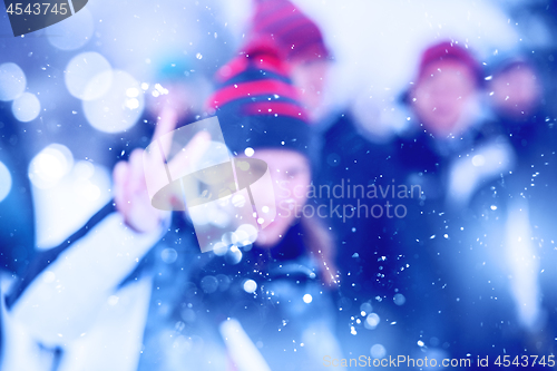 Image of Abstract blurred photo of young woman in beautiful winter landsc