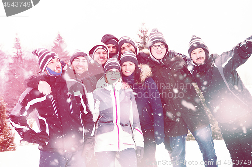 Image of portrait of group young people in beautiful winter landscape