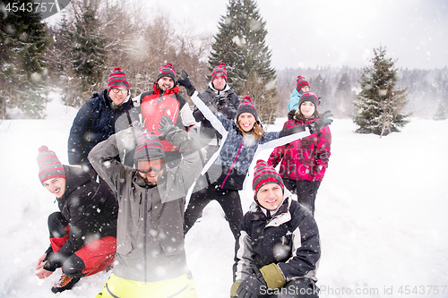 Image of portrait of group young people in beautiful winter landscape