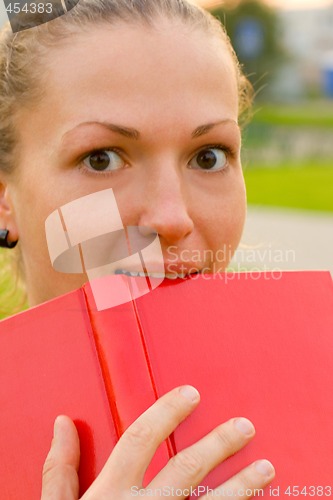 Image of woman with red book
