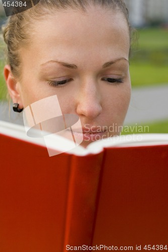Image of woman with red book