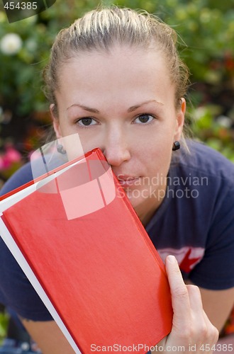 Image of woman with red book