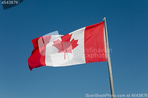 Image of Canadian Flag Against Blue Sky