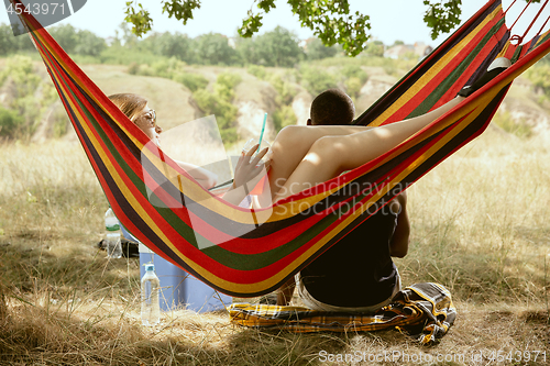 Image of Young multiethnic international couple outdoors