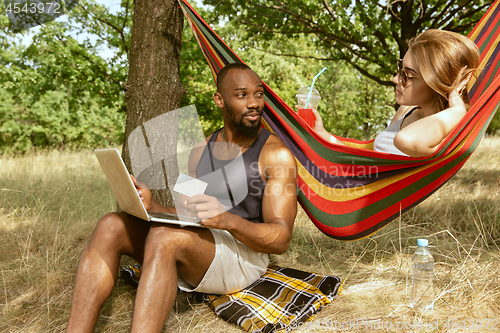 Image of Young multiethnic international couple outdoors