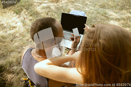 Image of Young multiethnic international couple outdoors