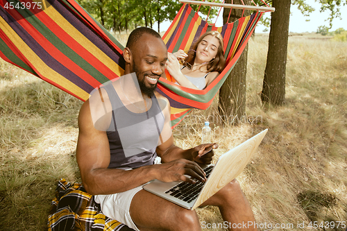 Image of Young multiethnic international couple outdoors