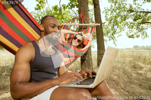 Image of Young multiethnic international couple outdoors