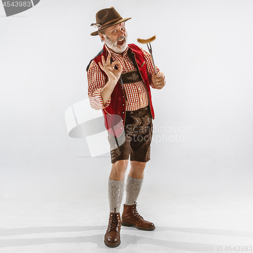 Image of Portrait of Oktoberfest man, wearing the traditional Bavarian clothes