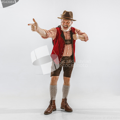 Image of Portrait of Oktoberfest man, wearing the traditional Bavarian clothes