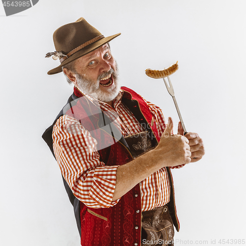 Image of Portrait of Oktoberfest man, wearing the traditional Bavarian clothes