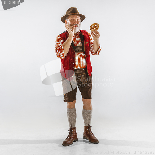 Image of Portrait of Oktoberfest man, wearing the traditional Bavarian clothes