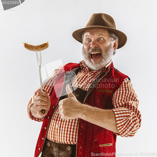 Image of Portrait of Oktoberfest man, wearing the traditional Bavarian clothes