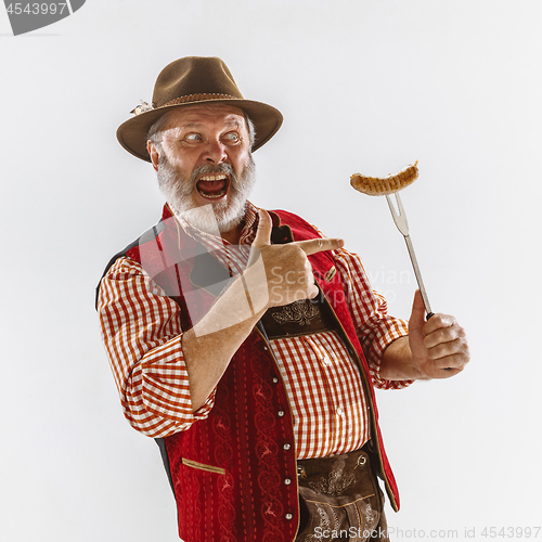 Image of Portrait of Oktoberfest man, wearing the traditional Bavarian clothes