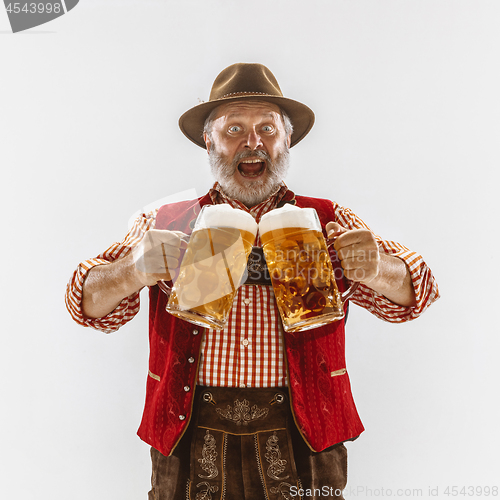 Image of Portrait of Oktoberfest man, wearing the traditional Bavarian clothes