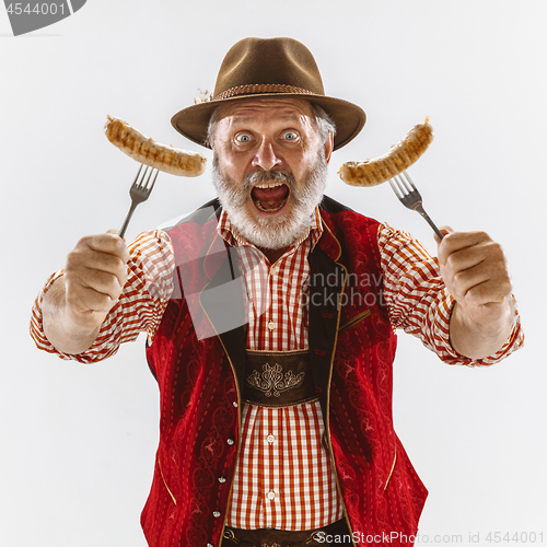 Image of Portrait of Oktoberfest man, wearing the traditional Bavarian clothes