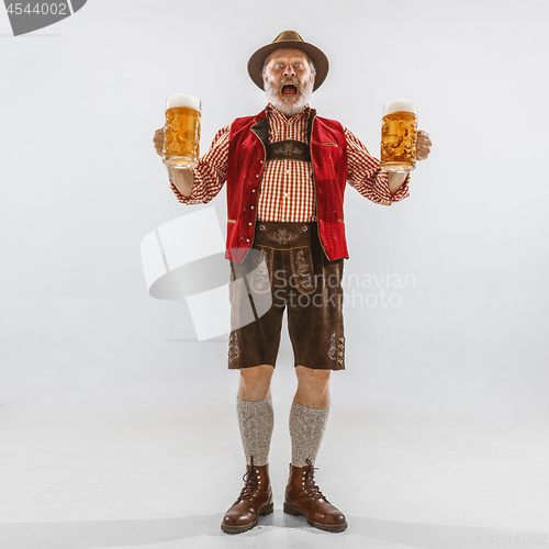 Image of Portrait of Oktoberfest man, wearing the traditional Bavarian clothes