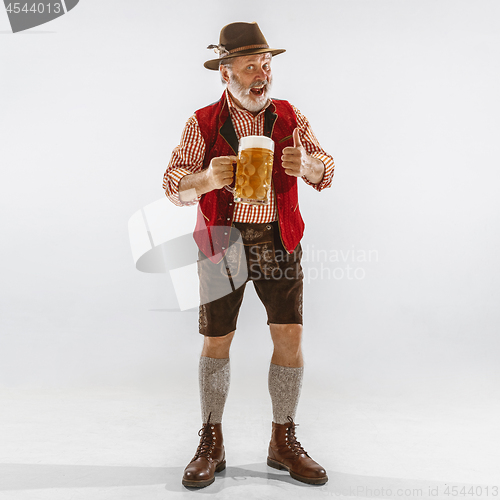 Image of Portrait of Oktoberfest man, wearing the traditional Bavarian clothes