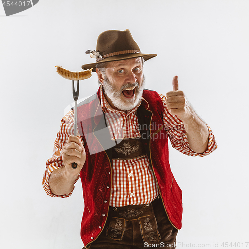 Image of Portrait of Oktoberfest man, wearing the traditional Bavarian clothes