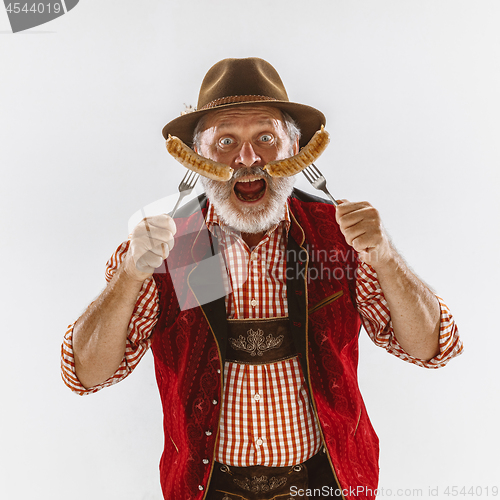 Image of Portrait of Oktoberfest man, wearing the traditional Bavarian clothes