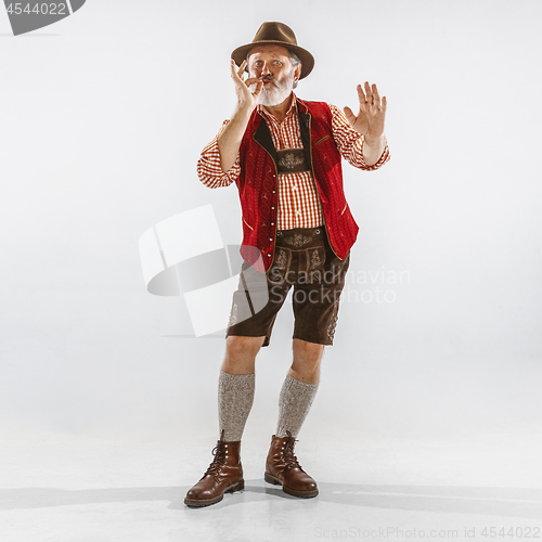 Image of Portrait of Oktoberfest man, wearing the traditional Bavarian clothes