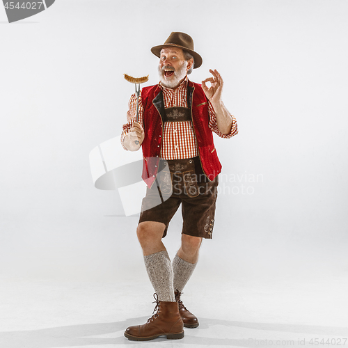 Image of Portrait of Oktoberfest man, wearing the traditional Bavarian clothes