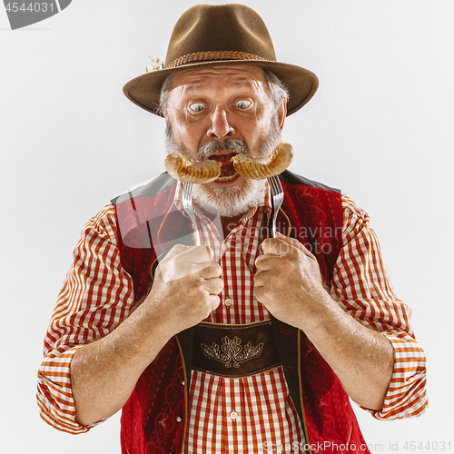 Image of Portrait of Oktoberfest man, wearing the traditional Bavarian clothes