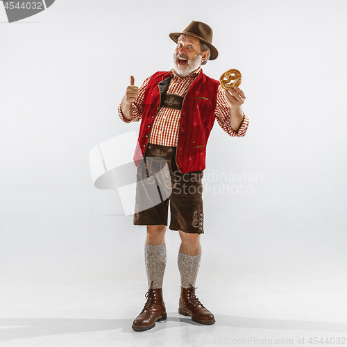 Image of Portrait of Oktoberfest man, wearing the traditional Bavarian clothes