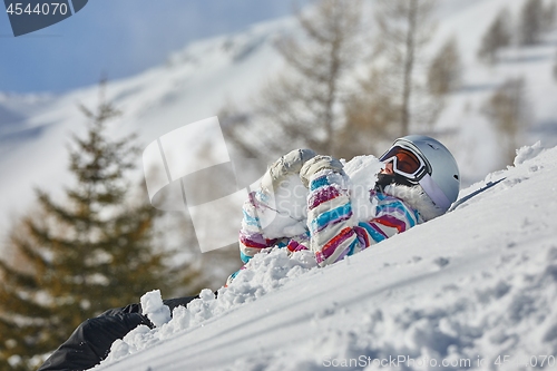 Image of Skier having a rest in the snow