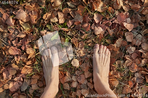 Image of Walking barefoot in autumn