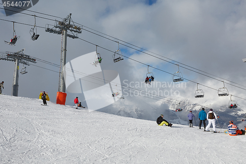 Image of Skiing slopes, with many people